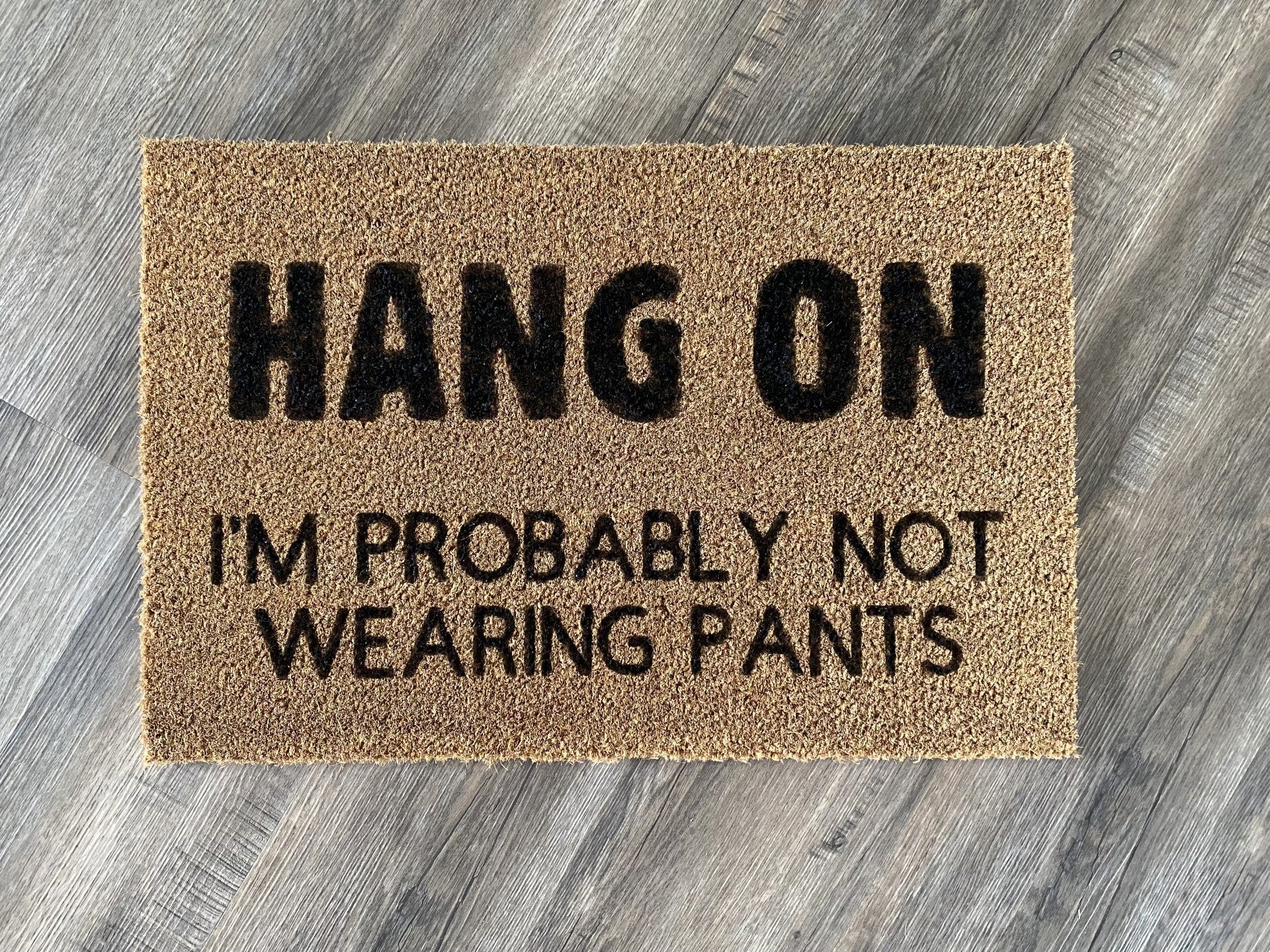 "Hang On, I'm Probably Not Wearing Pants" Door Mat